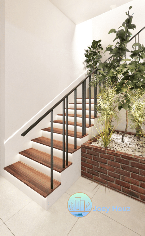 top interior designer near me Bring the outdoors in with this beautiful indoor plant display. A modern staircase with warm wood steps and subtle lighting. Clean lines and natural elements create a serene entryway.