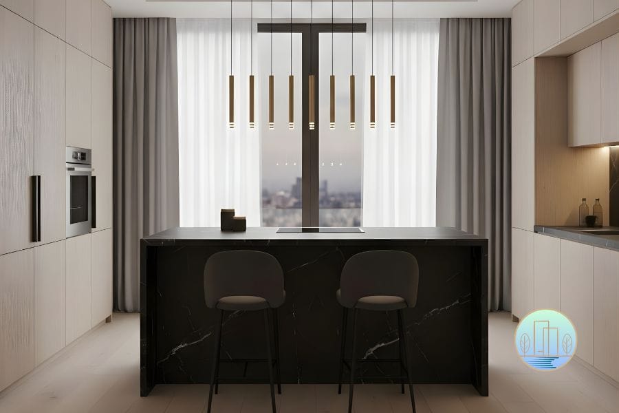 Modern minimalist luxe kitchen featuring a monolithic black marble island and seamless cabinetry in a Petaling Jaya home renovation by Houz Design.